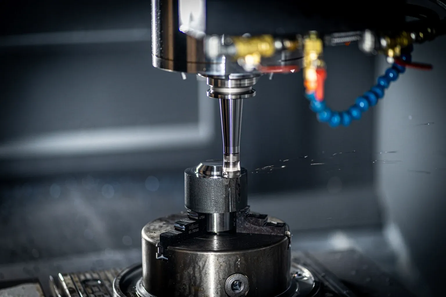 CNC milling machine cutting a metal workpiece